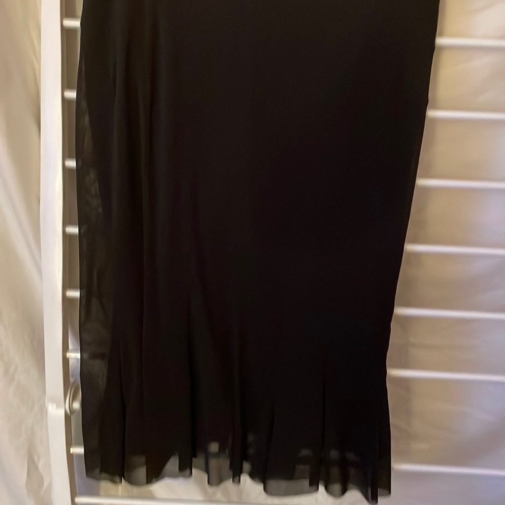 Vivian Tam black on black skirt
